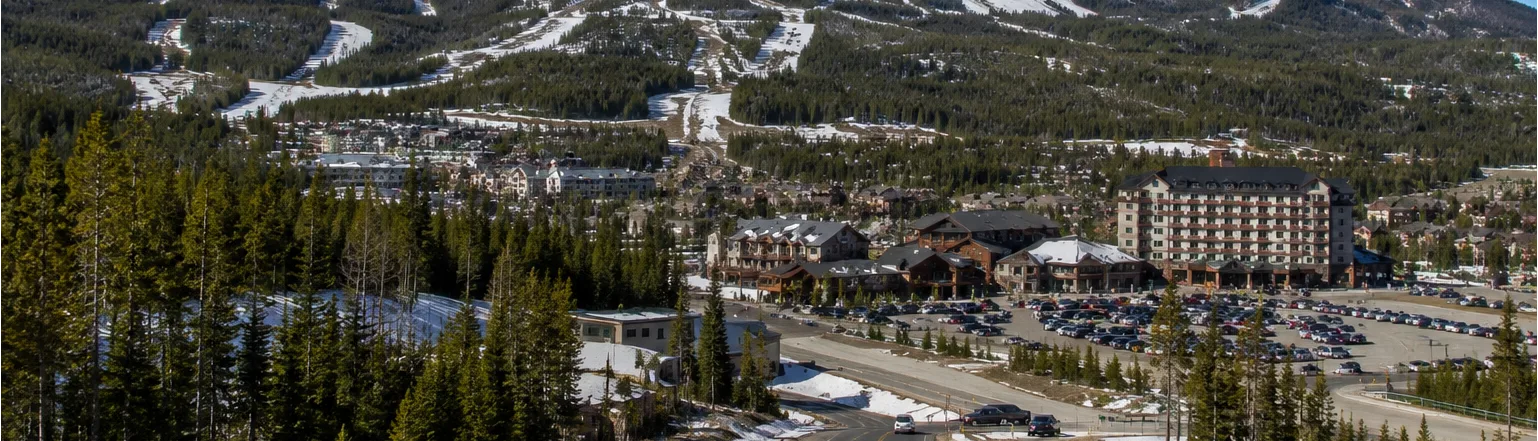 Big Sky, Montana, with lodges and residential development below forested ski slopes
